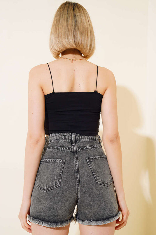 Short en jean noir à franges et jambes inversées