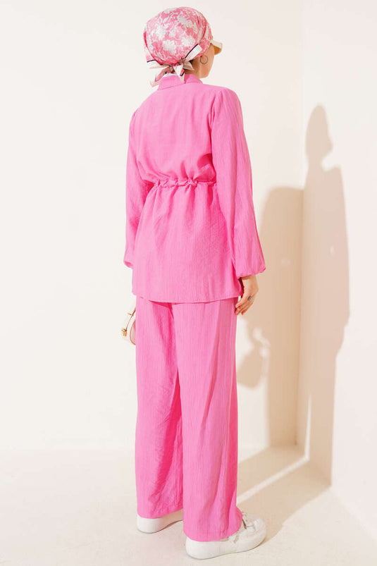 طقم مكون من قطعتين من نفق الخصر بجيوب وهمية باللون الوردي