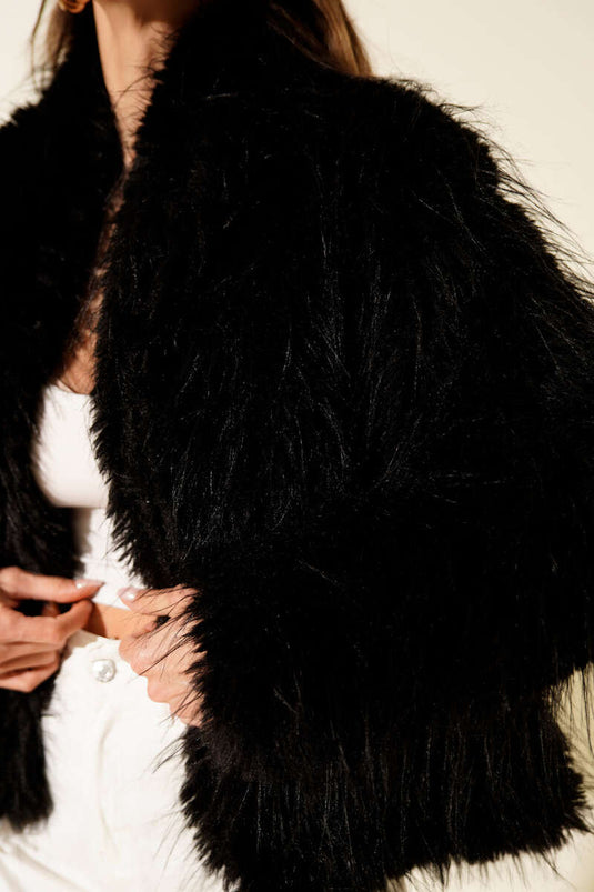 Loose-fitting coat with fur detail, black.