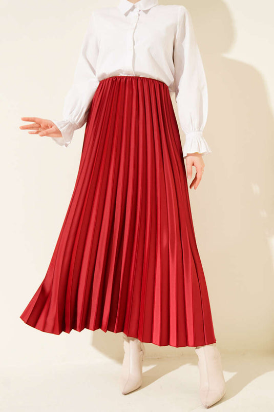 تنورة مطوية بمظهر ساتان، لون عنابي