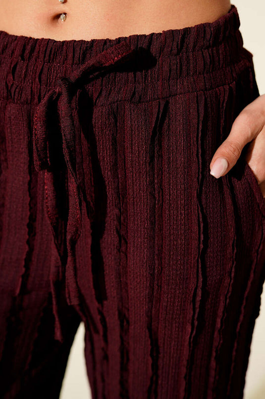 Pantalon rayé à volants et taille élastiquée, bordeaux