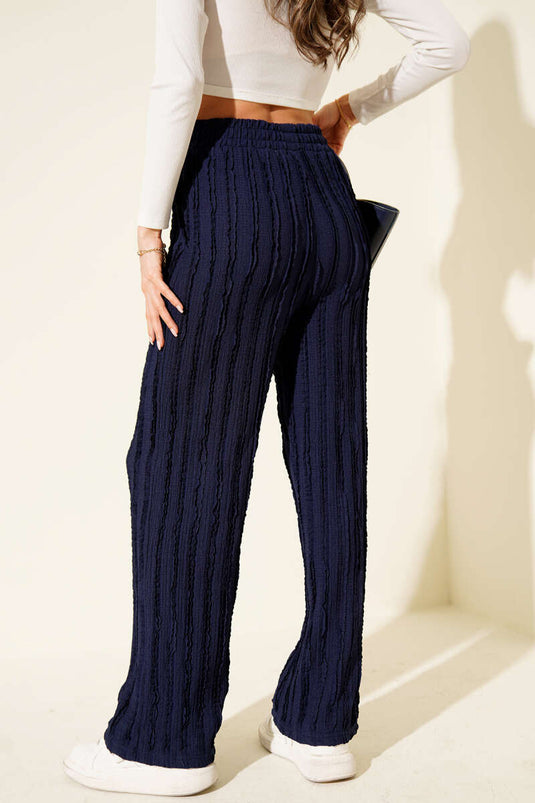 Pantalon bleu marine rayé à taille élastique et volants