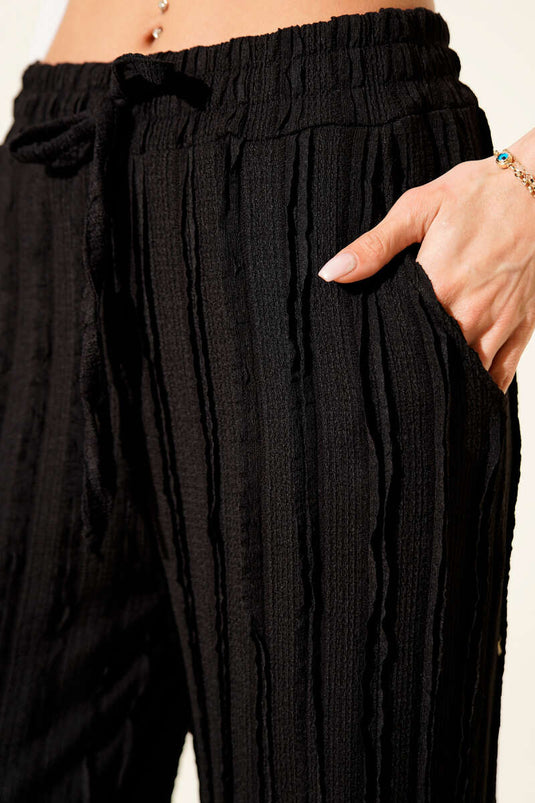 Pantalon rayé à volants et taille élastique, noir