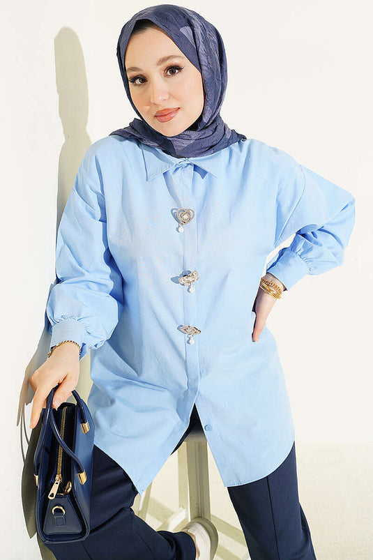 Blue Shirt with Hidden Buttons and Jeweled Brooch