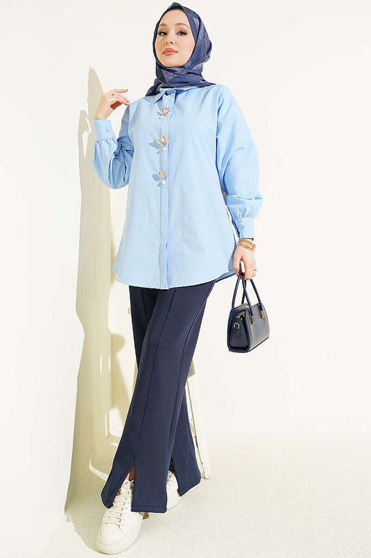 Blue Shirt with Hidden Buttons and Jeweled Brooch