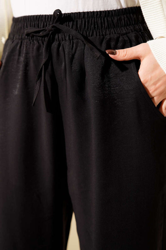 Schwarze Tencel Palazzo-Hose
