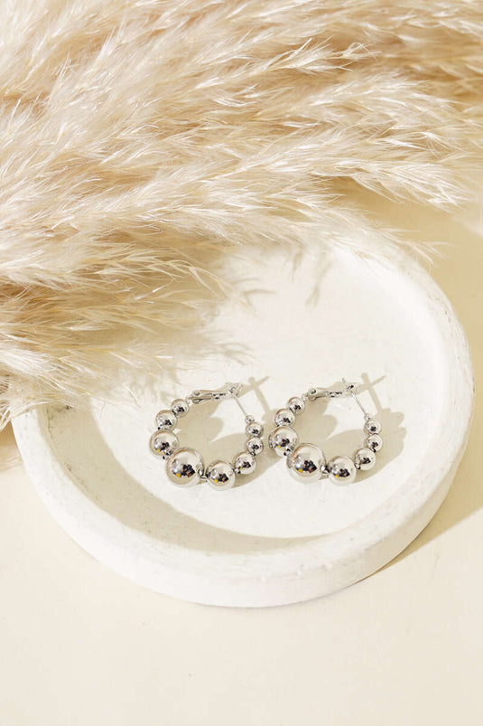 أقراط دائرية فضية على شكل كرة