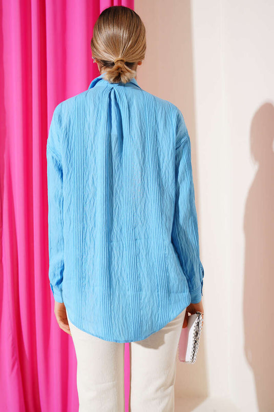 Chemise décontractée bleue à rayures transparentes et poches