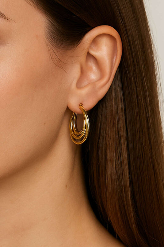 Oorbellen met drie ringen, goudkleurig.