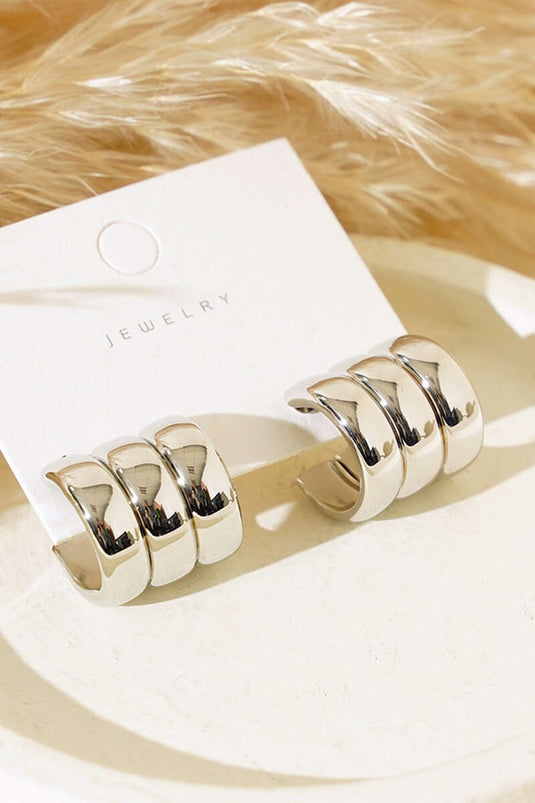 Boucles d'oreilles créoles triple effet argentées