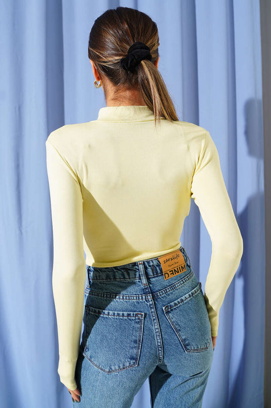 Chemisier à manches longues et demi-zip couleur citron vert.