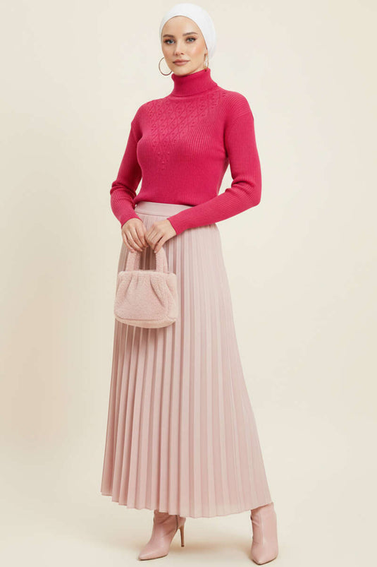 سترة محبوكة منقوشة بنقاط البولكا على شكل حرف V باللون الوردي