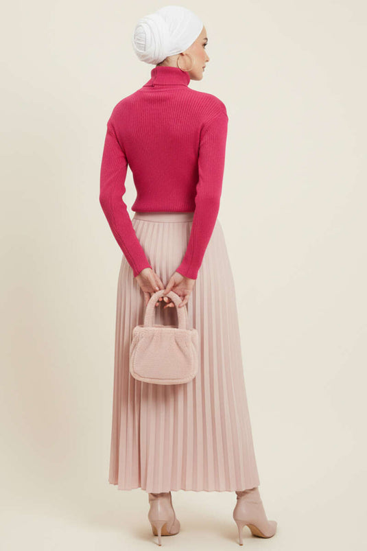 سترة محبوكة منقوشة بنقاط البولكا على شكل حرف V باللون الوردي