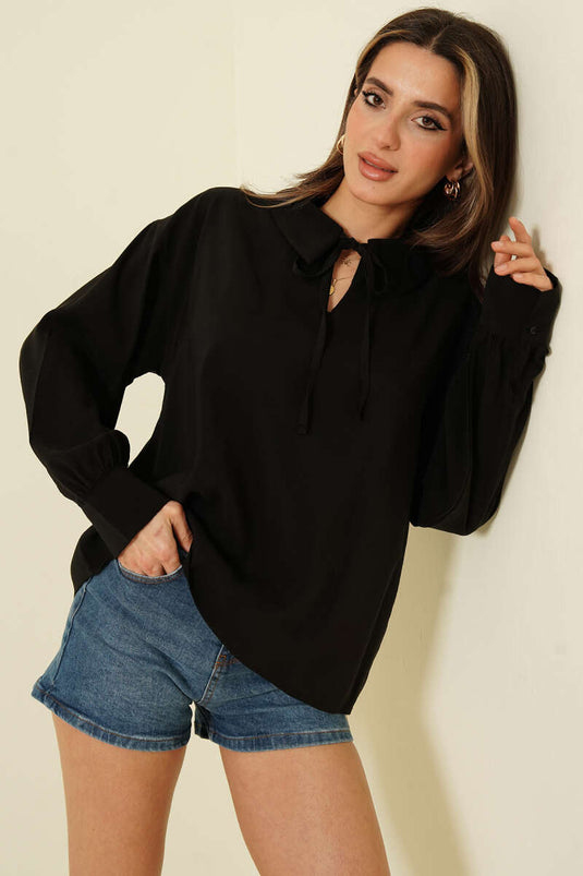 بلوزة تينسل بأكمام طويلة وياقة على شكل حرف V باللون الأسود