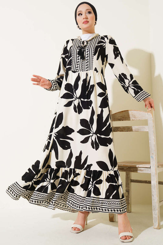 Robe noire à motifs avec col à volants et détails lacés