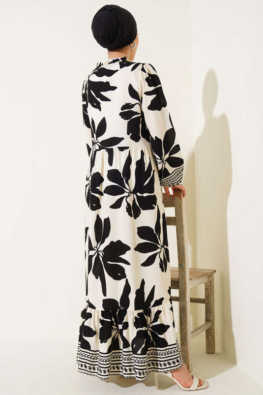 Robe noire à motifs avec col à volants et détails lacés