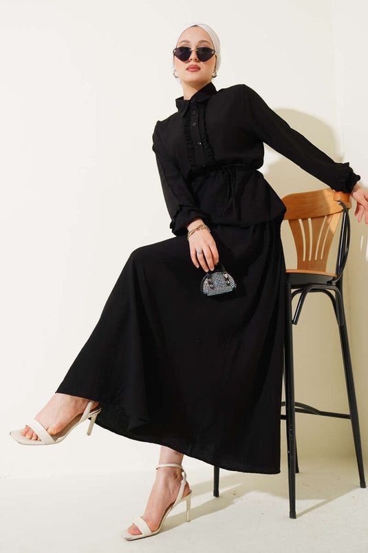 Two-piece set with skirt and collar ruffle detail, black.