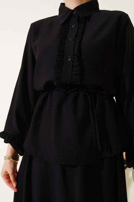 Two-piece set with skirt and collar ruffle detail, black.