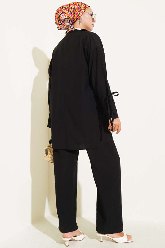 Geplooid tweedelig pak met detail, zwart