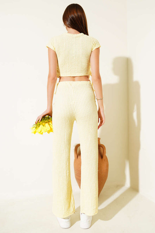 Tweedelige set met plooien aan de zijkant en wafelpatroon, geel