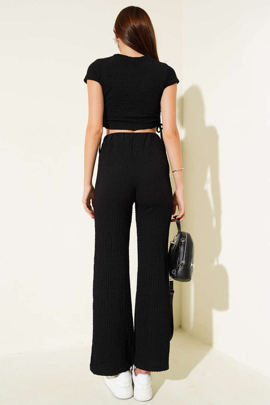 Tweedelige crop top met wafelstructuur en plooien aan de zijkant, zwart