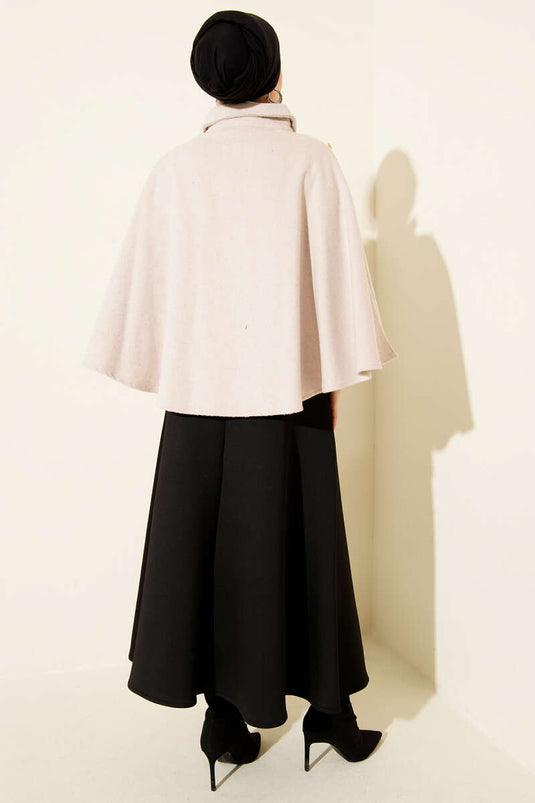 Poncho en cachemire beige avec boutons latéraux dorés