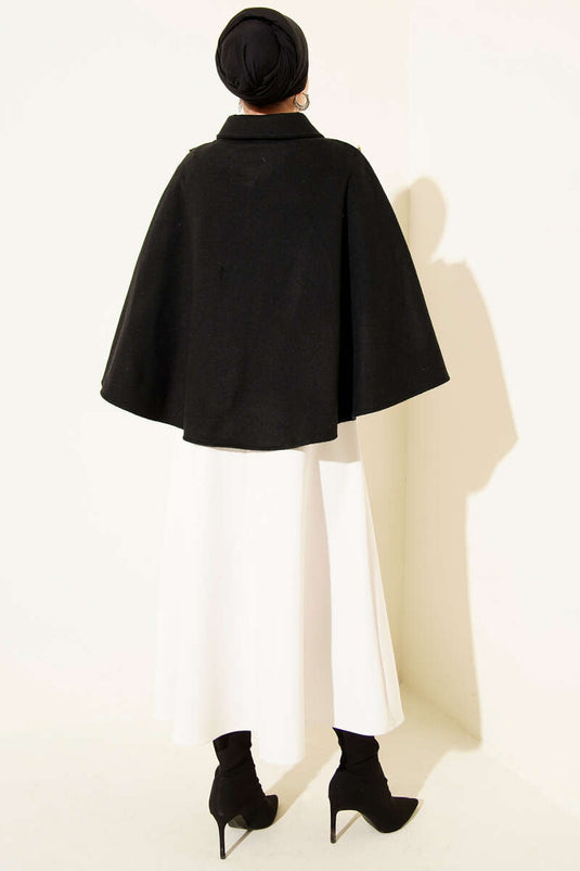 Poncho en cachemire noir avec boutons dorés sur les côtés