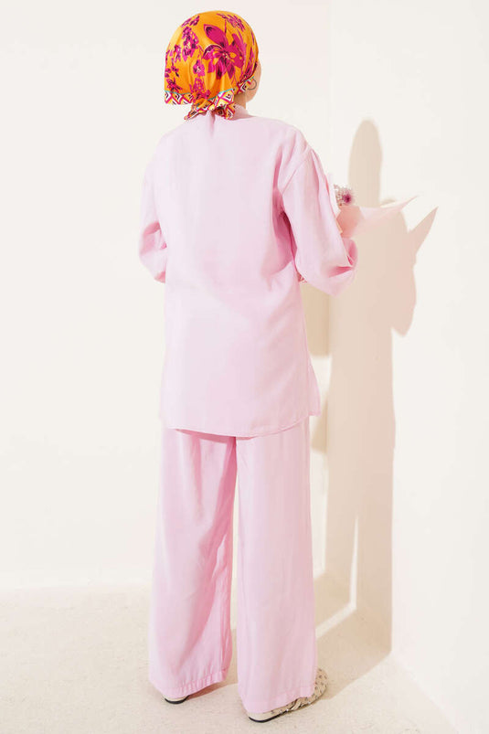 Costume deux pièces boutonné avec ceinture latérale rose