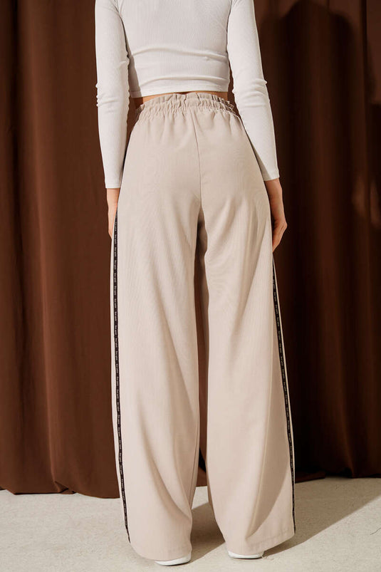 Pantalon Palazzo beige à taille élastique avec bande latérale contrastante