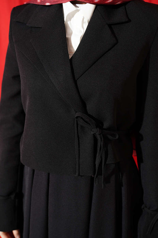 Ensemble deux pièces jupe et veste à lacets latéraux noir
