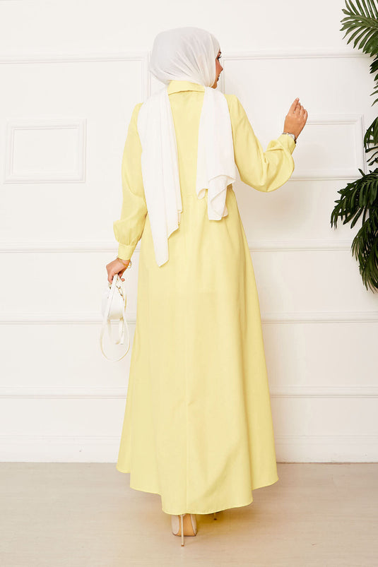 فستان أصفر برباط جانبي وياقة قميص