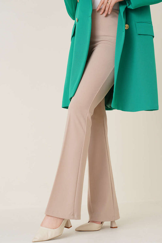 Pantalones beige de campana con cremallera lateral