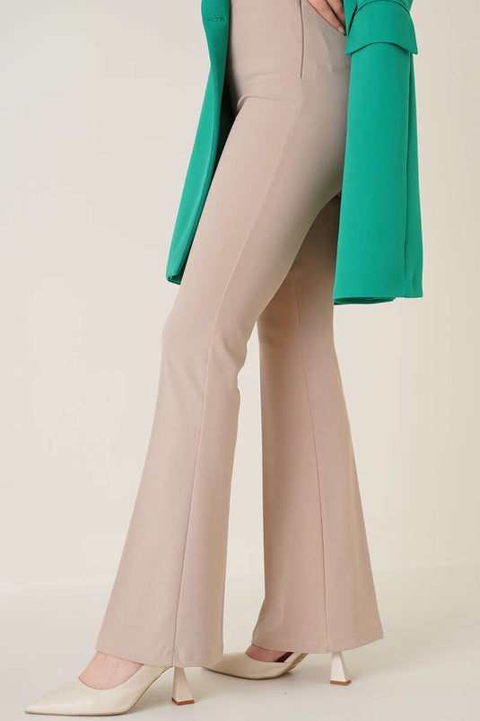 Pantalones beige de campana con cremallera lateral