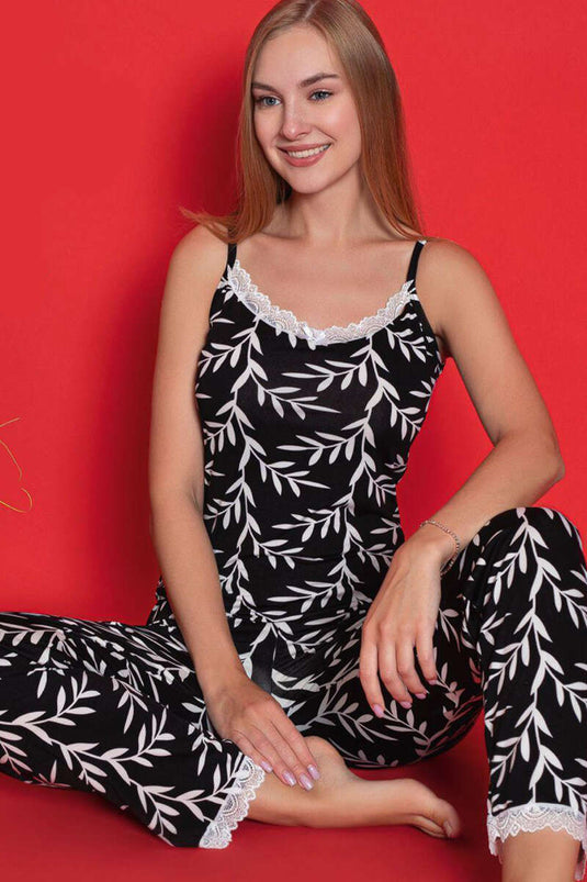 Ensemble pyjama noir à bretelles en dentelle et motif de feuilles