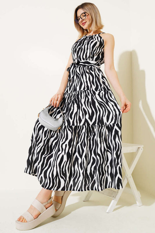 فستان أسود بدون أكمام بربطة عنق ونمط حمار وحشي