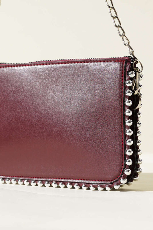 Sac à bandoulière chaîne cloutée bordeaux